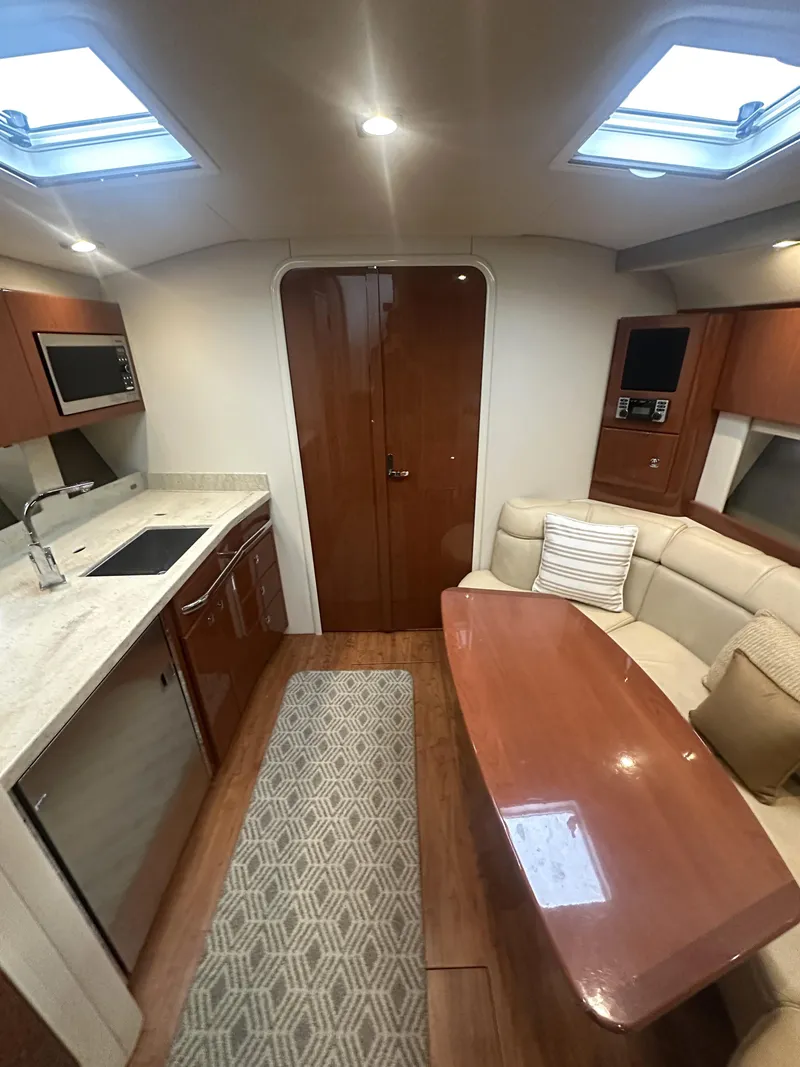 Slide: The Image of Interior of 2013 Formula 37 PC yacht with kitchen and seating area. - 14