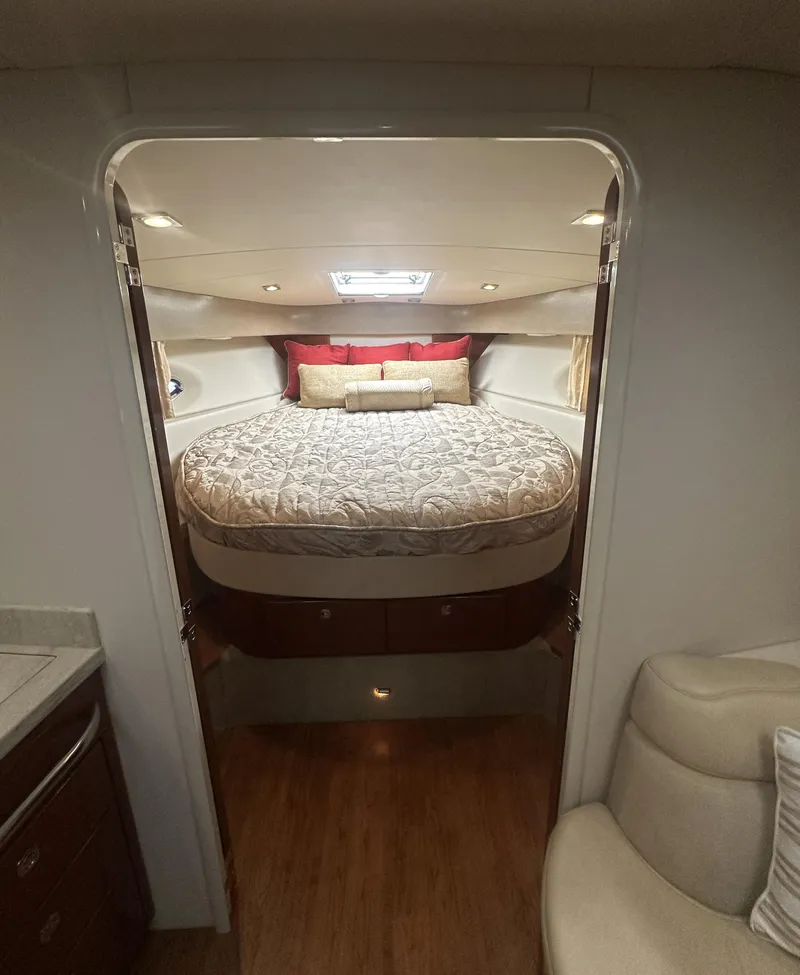 Slide: The Image of Luxurious cabin interior of a 2013 Formula 37 PC yacht with a cozy bed. - 15