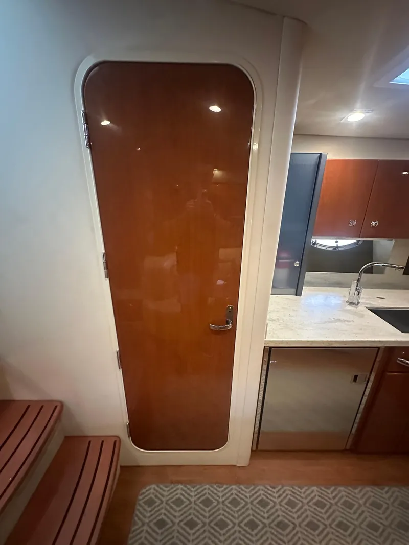 Slide: The Image of Interior of 2013 Formula 37 PC yacht with wooden door and kitchenette. - 19