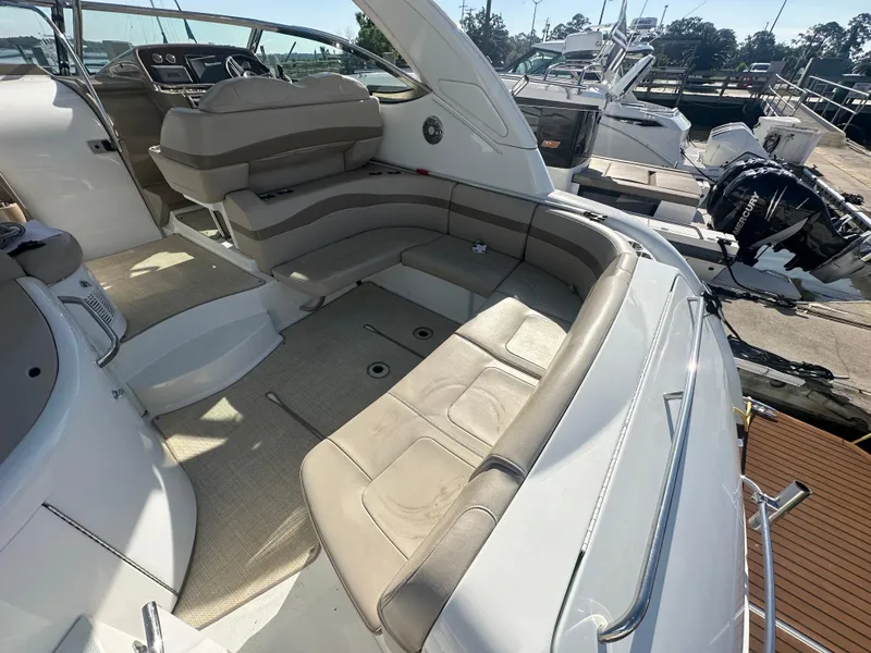 Slide: The Image of 2013 Formula 37 PC yacht interior with beige seating and modern dashboard. - 2