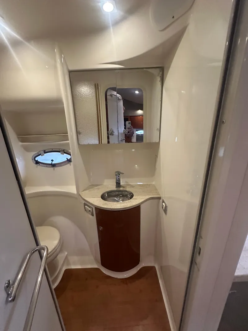 Slide: The Image of 2013 Formula 37 PC yacht bathroom with sink, mirror, and porthole window. - 21