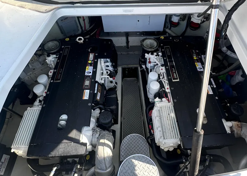 Slide: The Image of Engine compartment of a 2013 Formula 37 PC boat, featuring dual inboard engines. - 22
