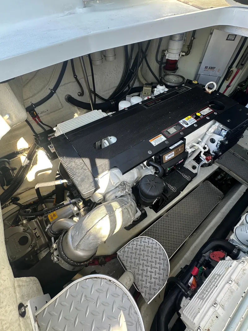 Slide: The Image of Engine compartment of a 2013 Formula 37 PC boat, showcasing detailed mechanical components. - 23