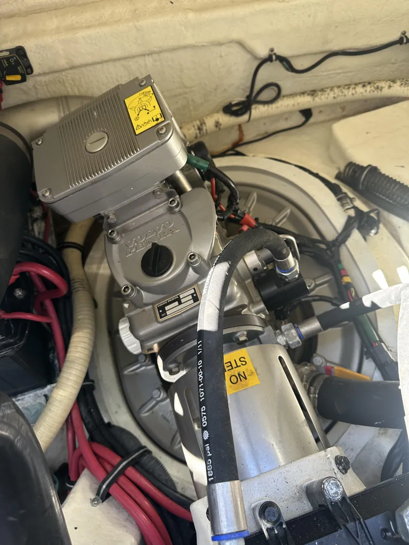 Slide: The Image of Engine compartment of a 2013 Formula 37 PC boat, showcasing mechanical components and wiring. - 26