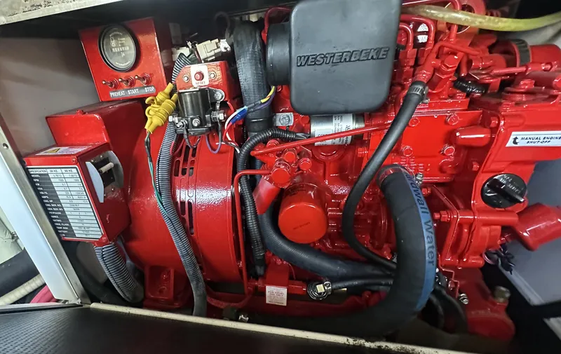 Slide: The Image of Red Westerbeke engine in a 2013 Formula 37 PC boat, showcasing detailed components. - 27
