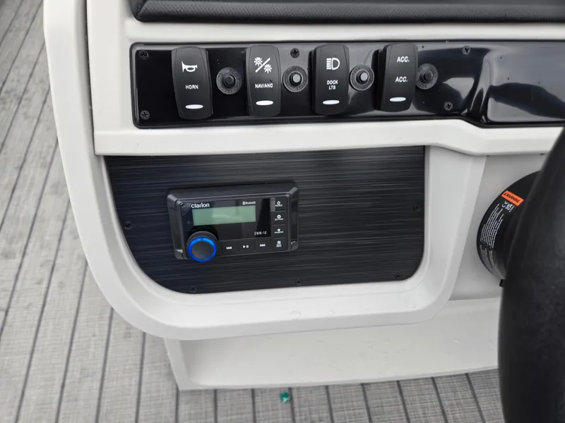 Slide: The Image of Control panel of 2026 Godfrey SWEETWATER Entertainment 2486 DT with switches and Clarion audio system. - 16