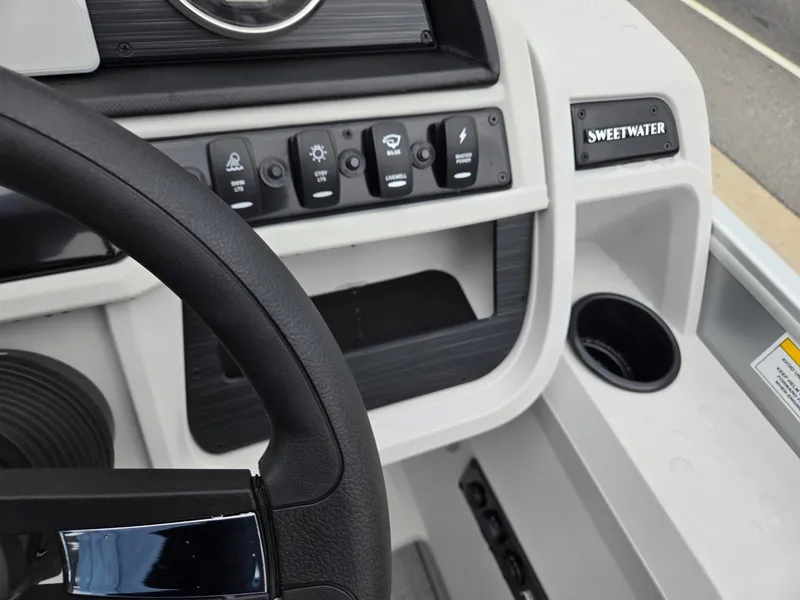 Slide: The Image of 2026 Godfrey SWEETWATER Entertainment 2486 DT dashboard with steering wheel and control panel. - 17