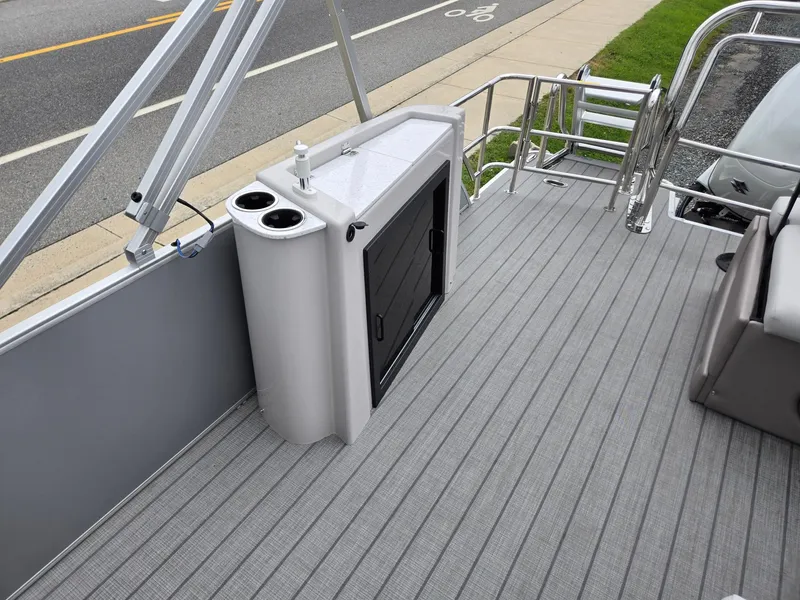 Slide: The Image of 2026 Godfrey SWEETWATER Entertainment 2486 DT boat deck with seating and railing. - 19