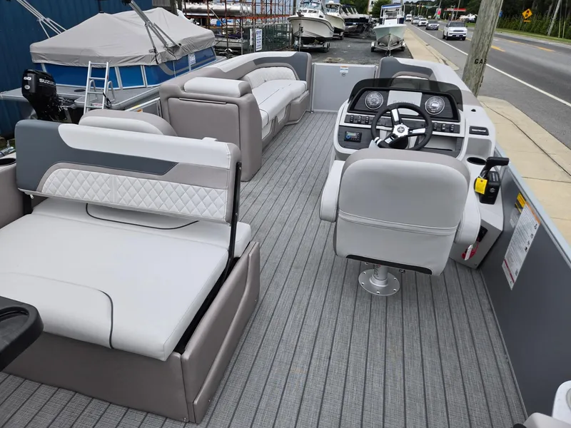 Slide: The Image of 2026 Godfrey SWEETWATER Entertainment 2486 DT pontoon boat interior with modern seating and helm. - 26