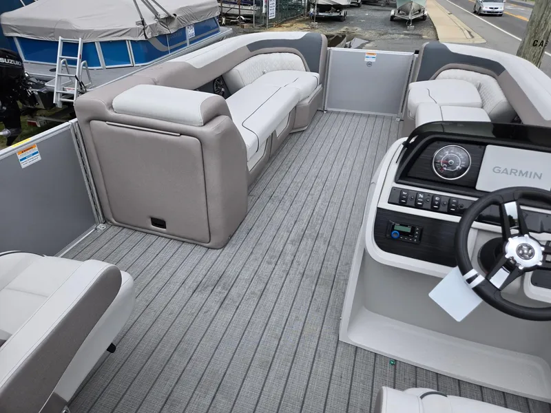 Slide: The Image of 2026 Godfrey SWEETWATER Entertainment 2486 DT pontoon boat interior with seating and Garmin dashboard. - 28