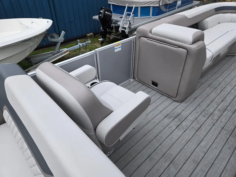 Slide: The Image of 2026 Godfrey SWEETWATER Entertainment 2486 DT boat interior with plush seating and modern design. - 29