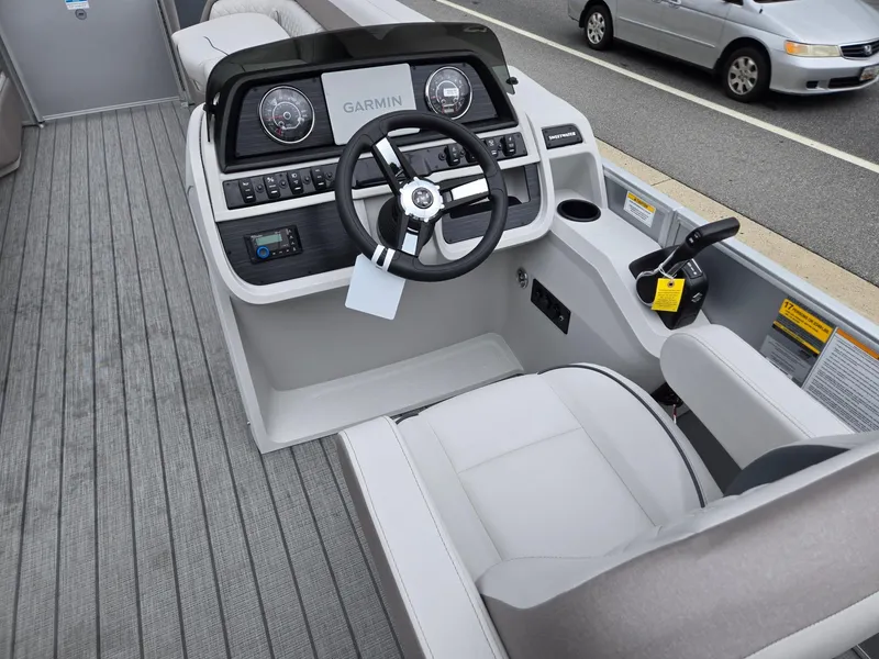 Slide: The Image of 2026 Godfrey SWEETWATER Entertainment 2486 DT boat cockpit with Garmin navigation system. - 30