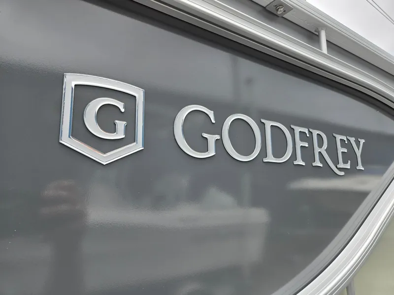 Slide: The Image of Godfrey SWEETWATER Entertainment 2486 DT 2026 logo on boat exterior. - 35