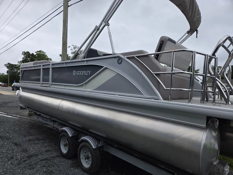 Slide: The Image of 2026 Godfrey SWEETWATER Entertainment 2486 DT pontoon boat on trailer, side view. - 4