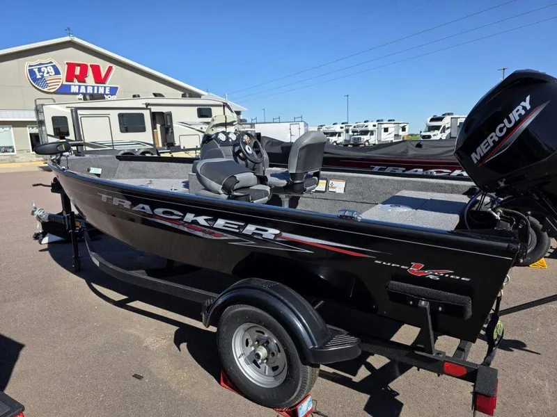 Slide: The Image of 2025 Tracker Super Guide V-16 SC boat at RV Marine dealership, featuring Mercury engine. - 4