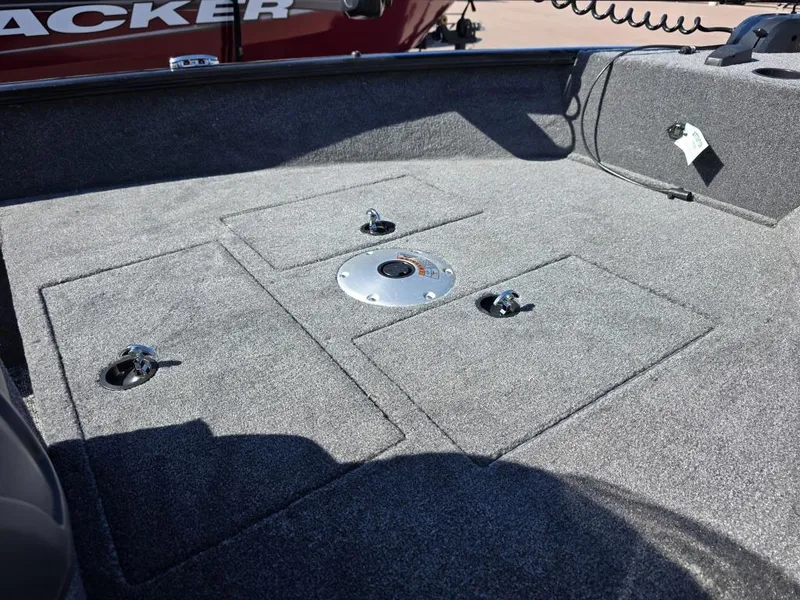 Slide: The Image of 2025 Tracker Super Guide V-16 SC boat deck with storage compartments and mounting points. - 9