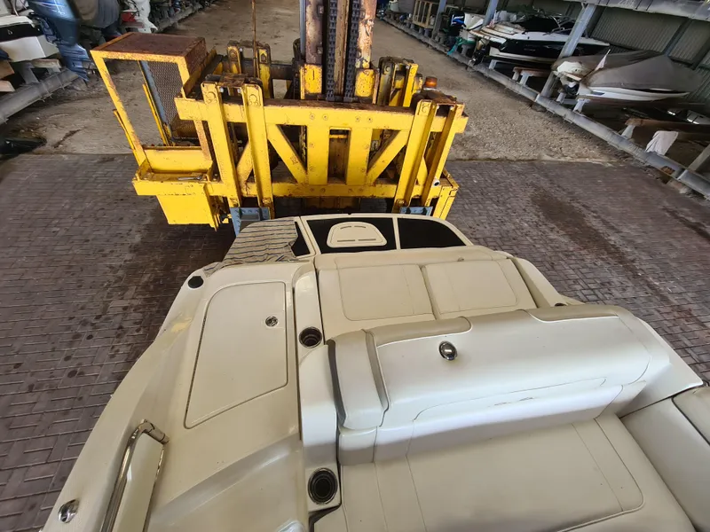 Slide: The Image of 2012 Sea Ray 260 Sundeck on forklift in storage facility. - 19