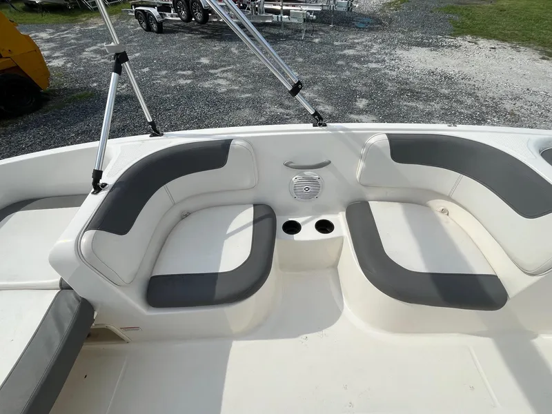 Slide: The Image of 2021 Bayliner Element E16 boat interior with gray seating and cup holders. - 8