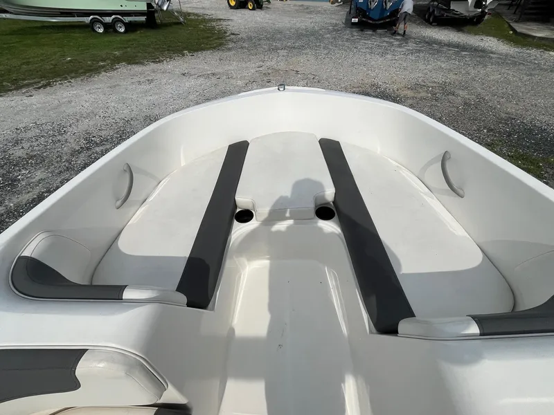 Slide: The Image of 2021 Bayliner Element E16 boat interior with white and gray seating. - 9