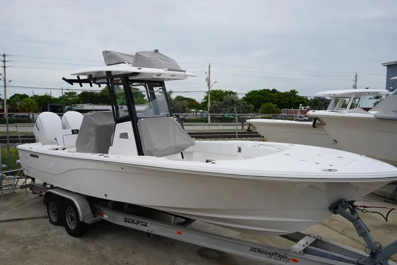 The Image of 2025 Sea Fox 282 Hybrid LT boat on trailer, parked outdoors. - 0