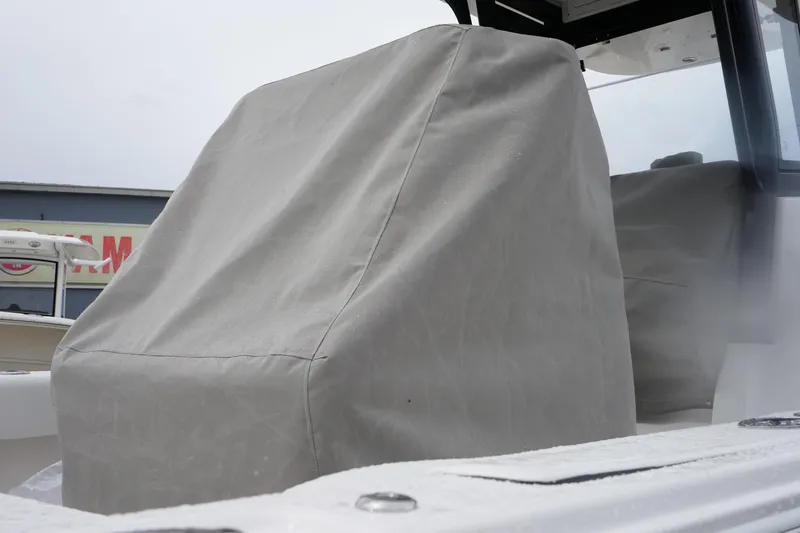 Slide: The Image of 2025 Sea Fox 282 Hybrid LT boat with covered seating, showcasing protective cover. - 10