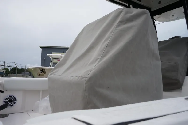 Slide: The Image of 2025 Sea Fox 282 Hybrid LT boat interior with covered seating and speaker. - 11