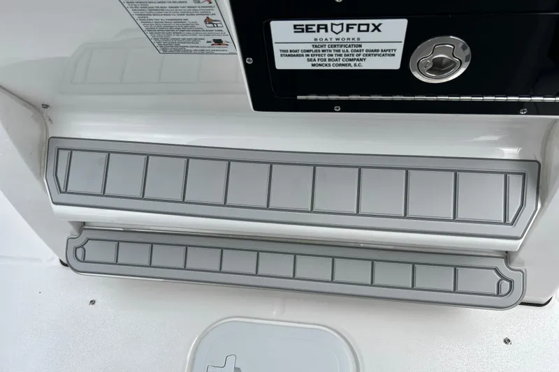 Slide: The Image of 2025 Sea Fox 282 Hybrid LT boat deck with non-slip steps and certification label. - 18