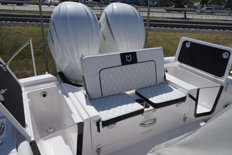 Slide: The Image of 2025 Sea Fox 282 Hybrid LT boat with dual Yamaha engines and cushioned seating. - 19