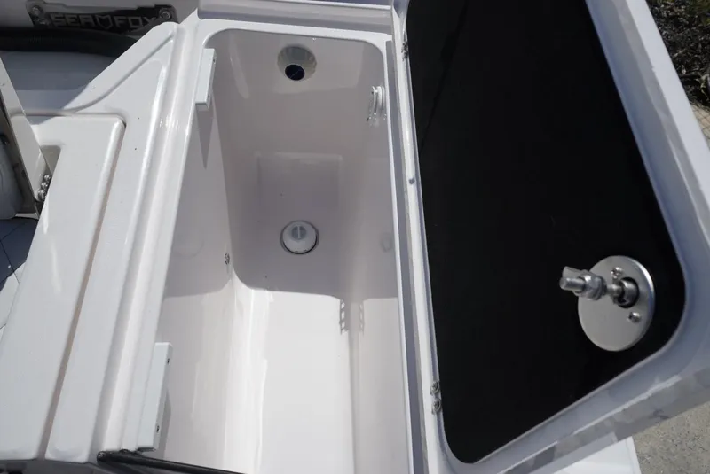 Slide: The Image of Open storage compartment on 2025 Sea Fox 282 Hybrid LT boat. - 21