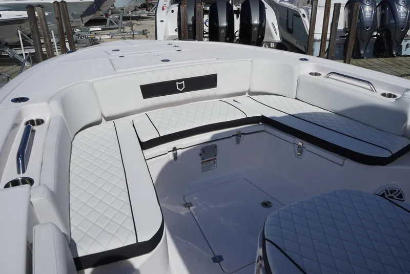 Slide: The Image of 2025 Sea Fox 282 Hybrid LT boat interior with white cushioned seating. - 23