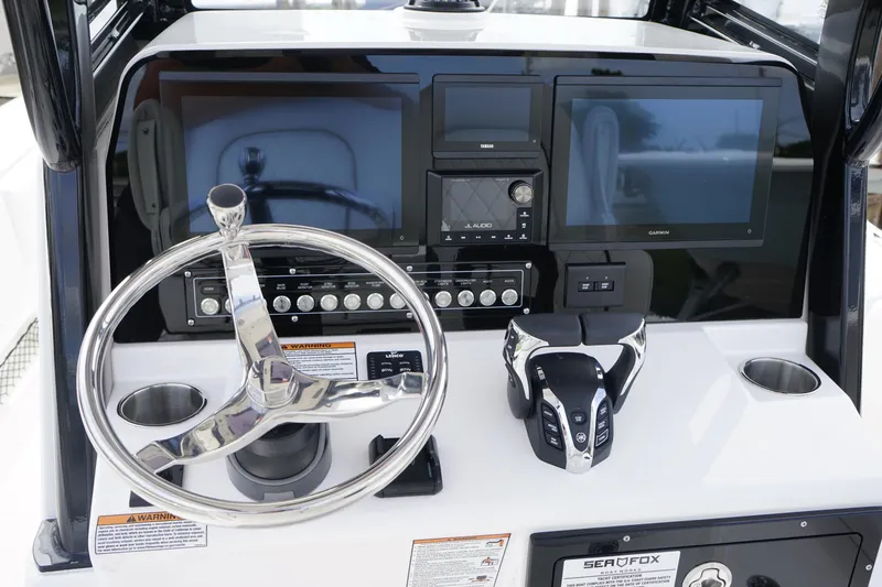 Slide: The Image of 2025 Sea Fox 282 Hybrid LT dashboard with dual screens and steering wheel. - 3