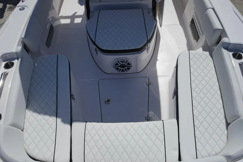 Slide: The Image of 2025 Sea Fox 282 Hybrid LT boat interior with diamond-stitched seating and speaker. - 30