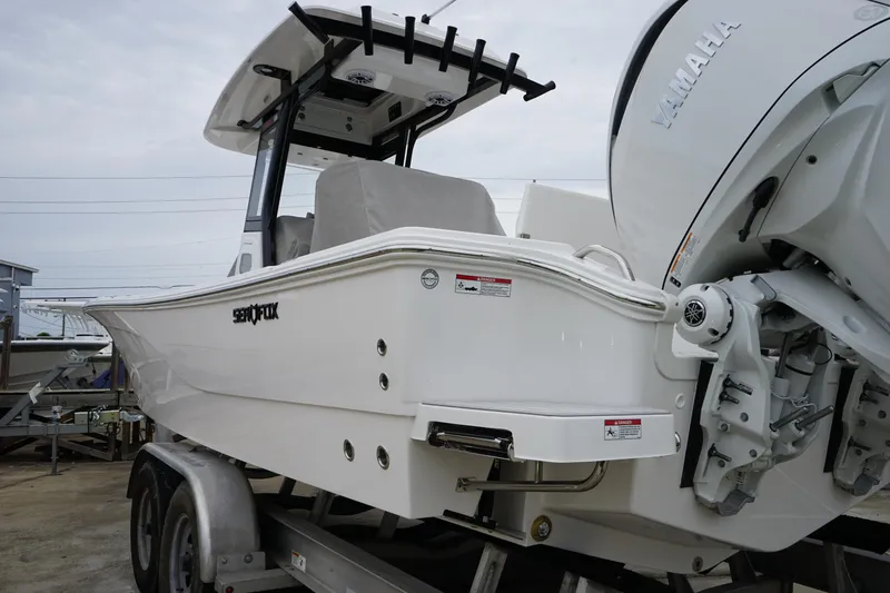 Slide: The Image of 2025 Sea Fox 282 Hybrid LT boat on trailer with Yamaha engine, side view. - 5