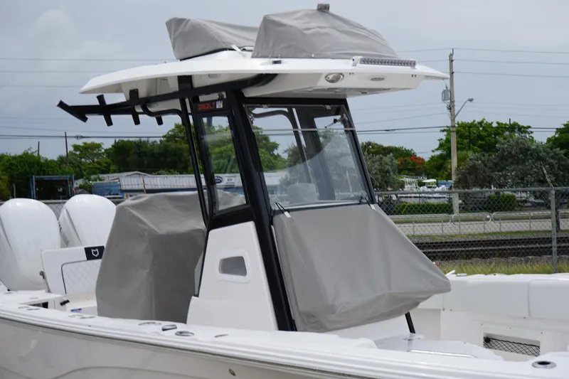 Slide: The Image of 2025 Sea Fox 282 Hybrid LT boat with covered console and dual engines. - 7