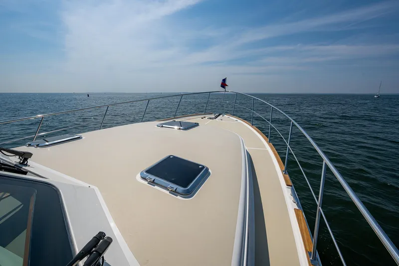 Slide: The Image of 2017 Grand Banks 44 Eastbay SX yacht cruising on open water. - 20