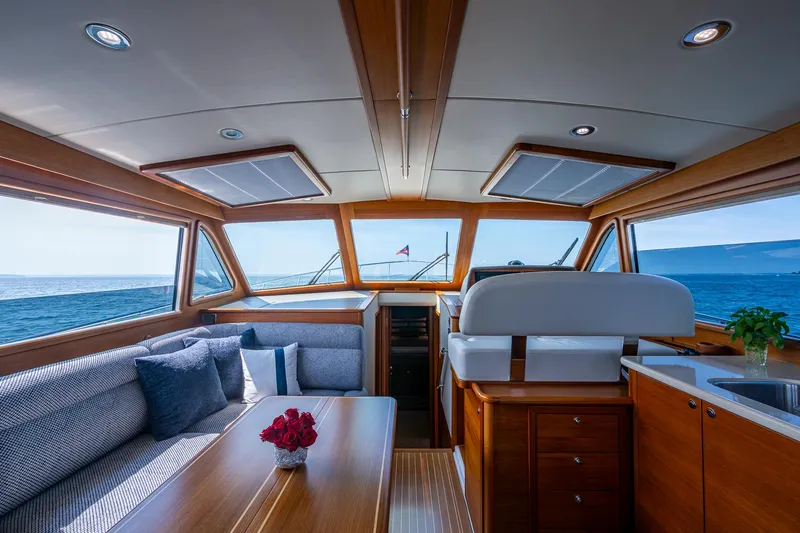 Slide: The Image of Luxurious 2017 Grand Banks 44 Eastbay SX yacht interior with wooden cabinetry and ocean view. - 26