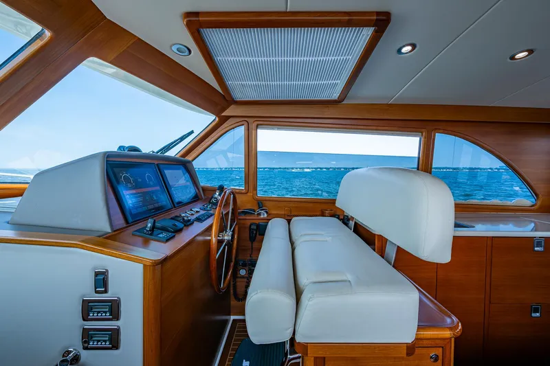 Slide: The Image of Helm of 2017 Grand Banks 44 Eastbay SX yacht with ocean view. - 28