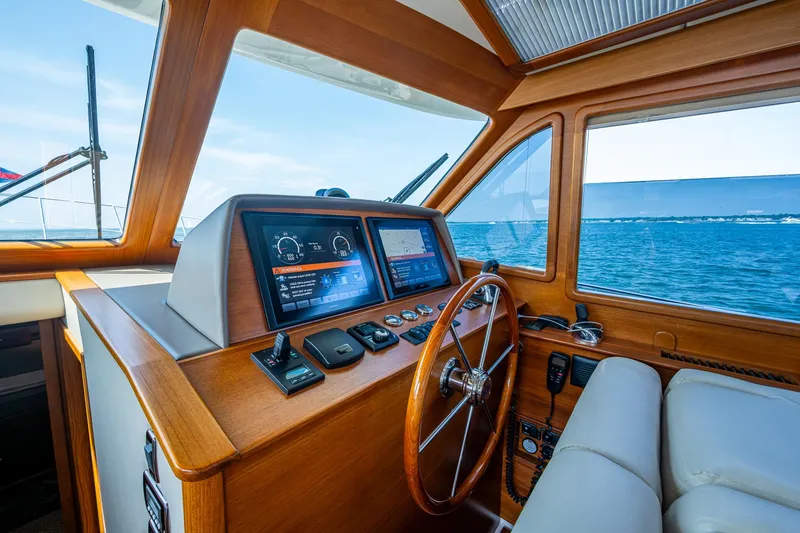 Slide: The Image of Helm of 2017 Grand Banks 44 Eastbay SX yacht with navigation screens and ocean view. - 29