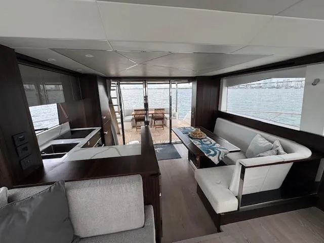 Slide: The Image of Luxurious interior of 2022 Sunseeker Manhattan 68 yacht with modern seating and ocean view. - 26