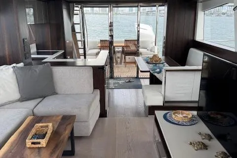 Slide: The Image of Luxurious interior of 2022 Sunseeker Manhattan 68 yacht with elegant seating and dining area. - 33