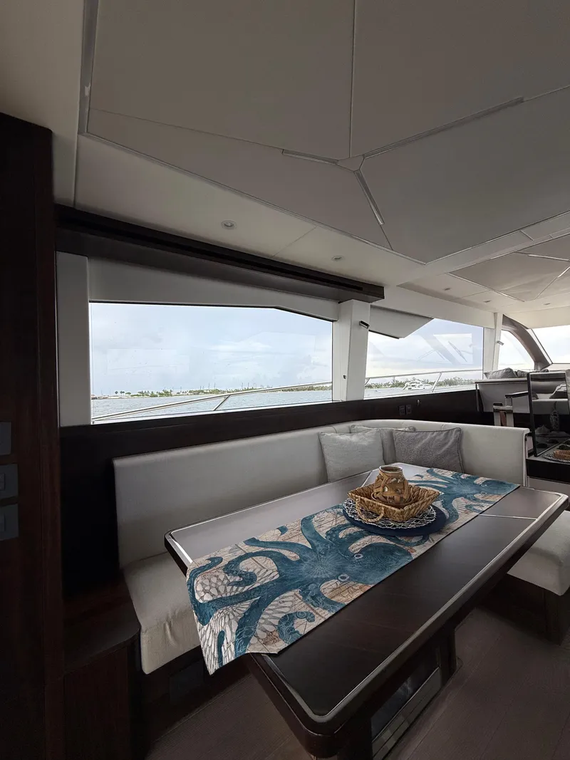 Slide: The Image of Luxurious interior of 2022 Sunseeker Manhattan 68 yacht with elegant dining area. - 34