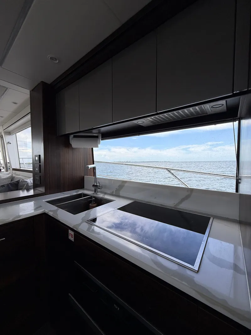 Slide: The Image of Modern kitchen interior of 2022 Sunseeker Manhattan 68 yacht with ocean view. - 43
