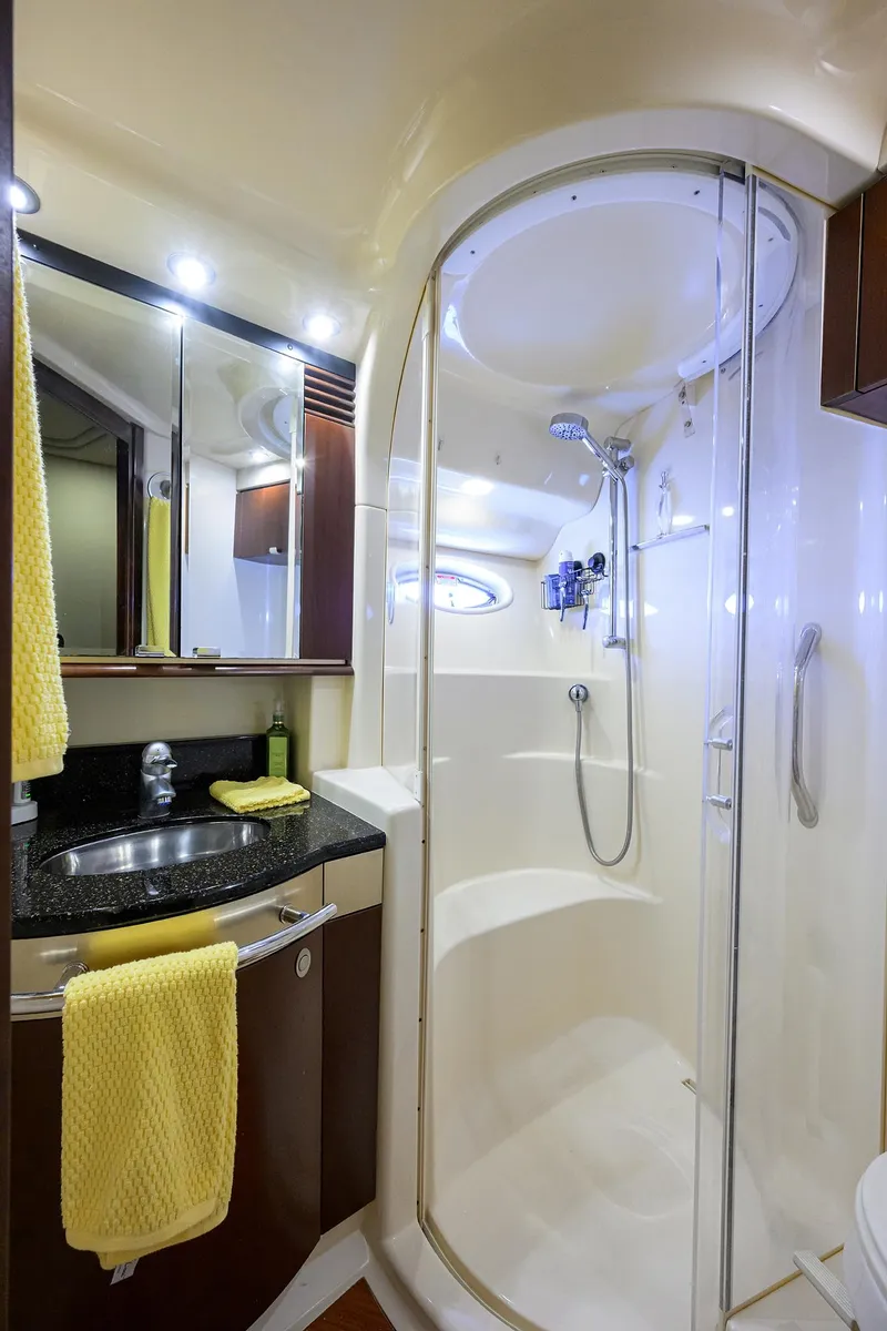 Slide: The Image of Luxurious bathroom in 2005 Sea Ray 52 Sedan Bridge yacht with modern shower and sink. - 10