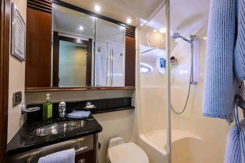 Slide: The Image of Luxurious bathroom in 2005 Sea Ray 52 Sedan Bridge yacht with modern amenities. - 14