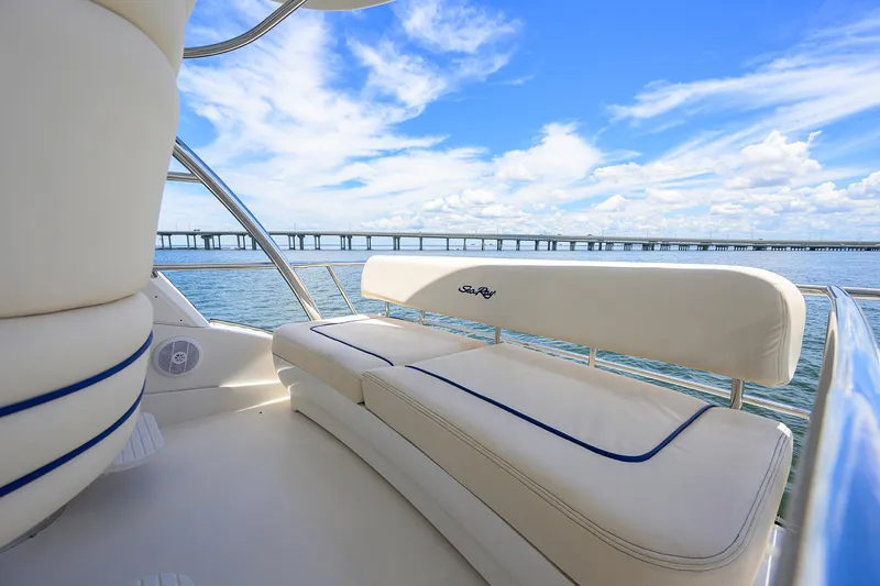Slide: The Image of 2005 Sea Ray 52 Sedan Bridge yacht interior with ocean view and bridge in background. - 21
