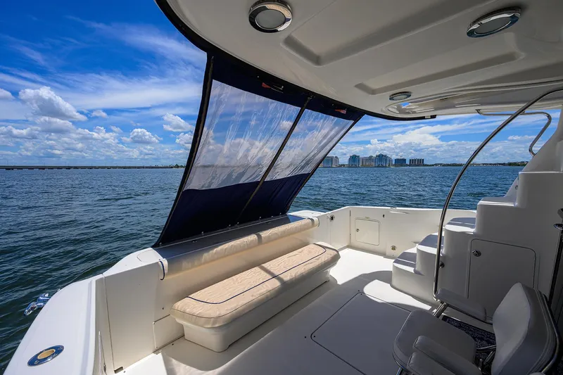 Slide: The Image of 2005 Sea Ray 52 Sedan Bridge yacht interior with ocean view and seating area. - 27