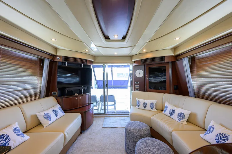 Slide: The Image of Luxurious interior of 2005 Sea Ray 52 Sedan Bridge yacht with plush seating and modern decor. - 3