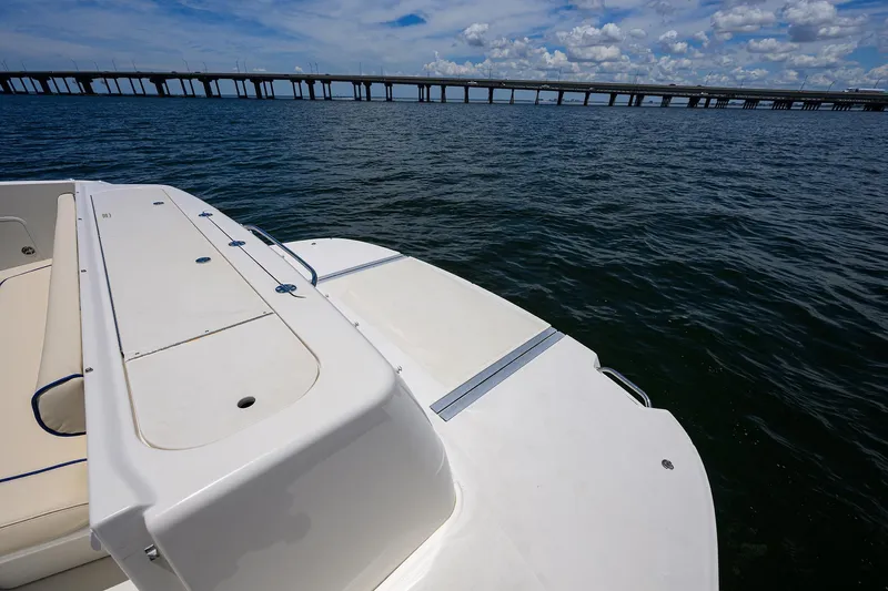 Slide: The Image of 2005 Sea Ray 52 Sedan Bridge yacht on water with bridge in background. - 32