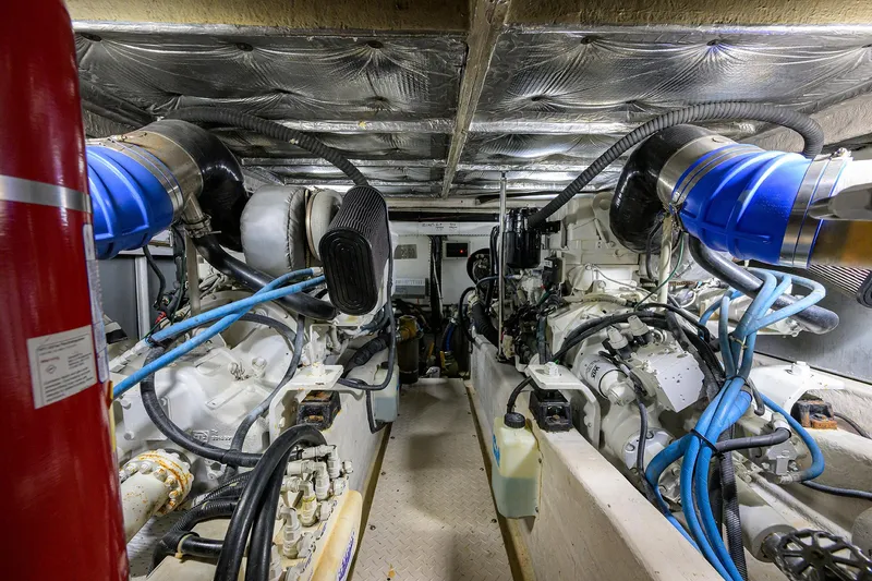 Slide: The Image of Engine room of 2005 Sea Ray 52 Sedan Bridge with visible machinery and components. - 35