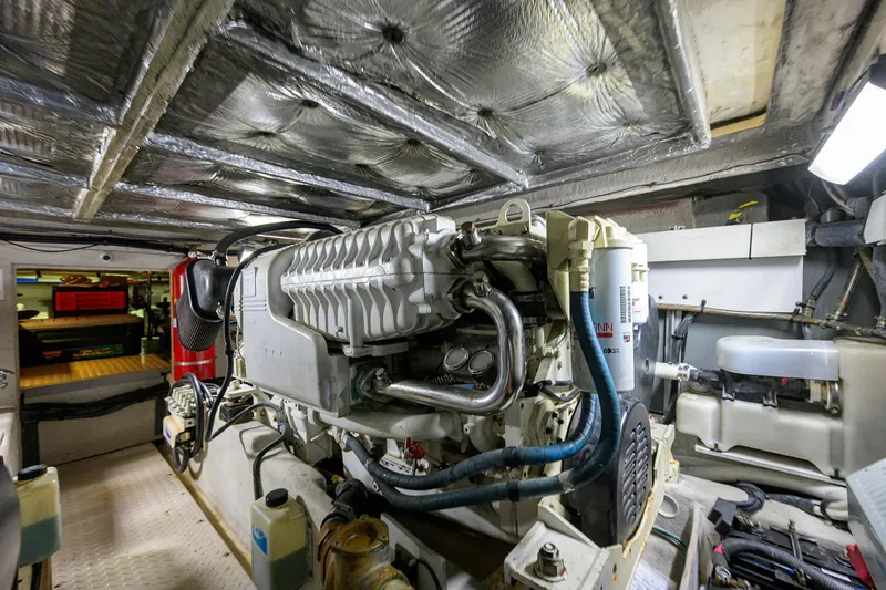 Slide: The Image of Engine room of a 2005 Sea Ray 52 Sedan Bridge yacht, showcasing machinery and equipment. - 37